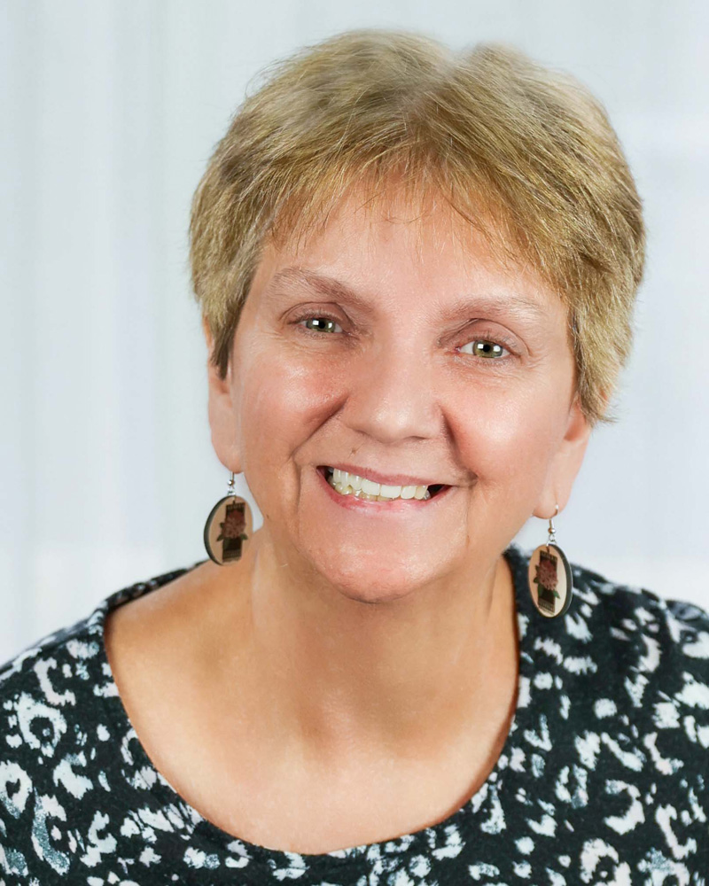 LSPA Staff Member Poses for headshot.